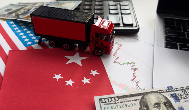 USA and China flag on coins stacking, Concept of Recession conflict tax business finance money, Symbol of economic tariffs trade war and tax barrier between United States of America and China.