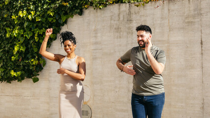 Couple of dancers performing cuban salsa in the street