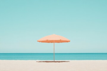 Fototapeta premium Sunny beach umbrella stands alone in the serene ocean breeze
