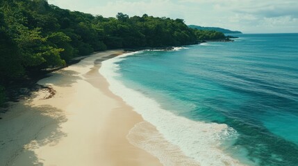 Obraz premium Serene Tropical Beach Vista: Pristine Sands Meet Turquoise Waters Under Clear Skies