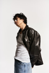 Obraz premium Stylish asian model strikes a pose in bright studio light