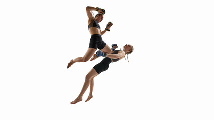 Dramatic airborne fight between female MMA fighters captured in synchronized movement with power...