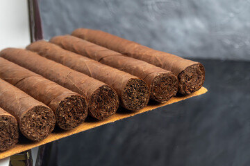Cigars on a dark background. Product for sale.