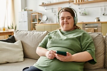 Joyful young woman embracing comfort at home while enjoying music and relaxation