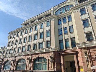 historical pink building with multiple floors, adorned with decorative features and air...