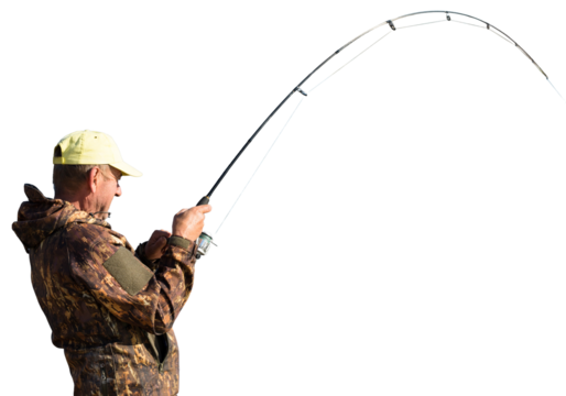 Fishing in the reeds for spinning on quiet water. A man in camouflage clothes in cool weather is fishing on the river bank.