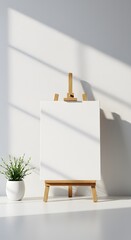 a blank white canvas on a simple wooden easel, positioned against a bright white wall. A small potted plant is subtly placed, Blank canvas on easel in a modern room with natural light and a plant. 