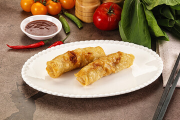 Vietnamese stuffed spring roll served sauce