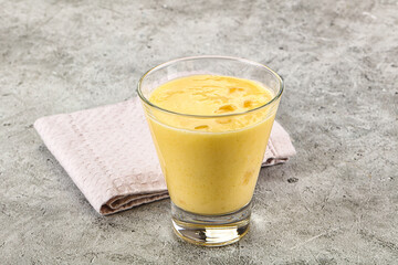 Cold sweet mango smoothie glass