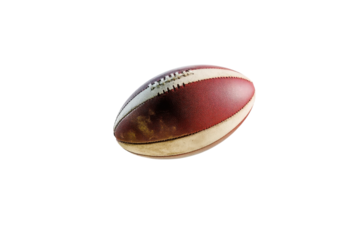 A vintage leather football glides effortlessly through the air against a simple backdrop isolated on transparent background
