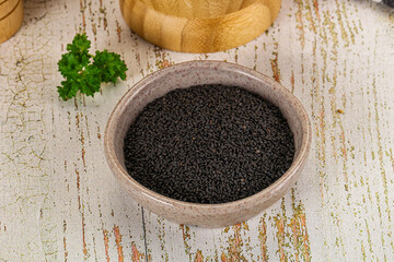 Black dry Nigella seeds in the bowl