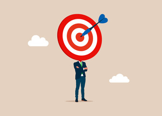 Businessman with a wearing dartboard instead of a head on shoulders. Progress to goal or reaching business target, motivation or challenge to achieve success, career growth or improvement concept.