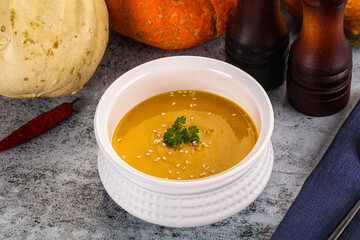 Vegan pumpkin cream soup served sesam