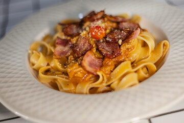 Fettuccine Pasta With Bacon And Red Sauce