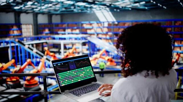 Engineer Worker Using Warehouse Automation Dashboard