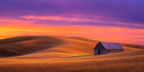 Fototapete Rund A serene landscape featuring a rustic barn against a vibrant sunset over rolling hills. © Saban2