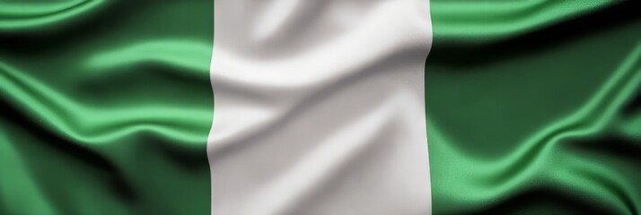 Fototapeta premium Flowing Fabric Flag of Nigeria Waving In The Wind Three Vertical Green, White, And Green Stripes
