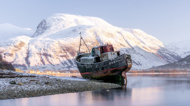 Old boat wreck at Caol with Ben Nevis in the background, Scottish Highlands, Scotland