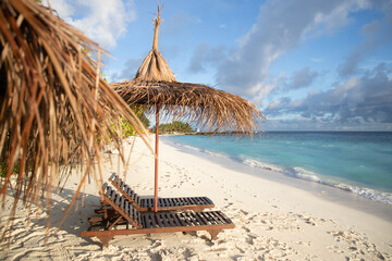 Beach chairs on beautiful tropical beach, The Maldives, Indian Ocean