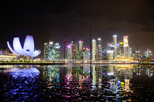 Skyline of Singapore Marina Bay at night downtown core skyscrapers and the Art Science museum, Singapore