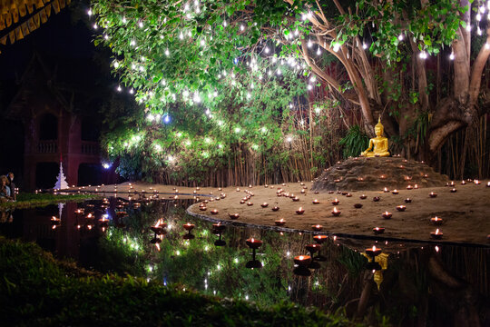 Makha Bucha (Magha Puja) celebrations, illuminated Buddha statue at Wat Phan Tao temple, Chiangmai, Thailand