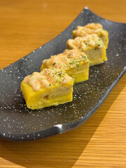 asian japanese sushi mentai cheese egg roll in long plate on wood table asian dim sum halal food...