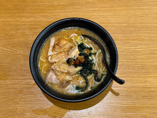 asian japanese ramen soup chicken teriyaki seaweed in bowl on wood table asian dim sum halal food...