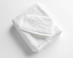 Folded White Terry Towel on White Background Cleanliness and Freshness