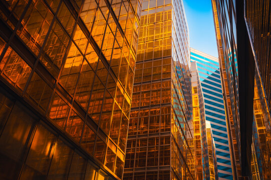Gateway boulevard at harbour with golden buildings at sunset, Kowloon, Hong Kong