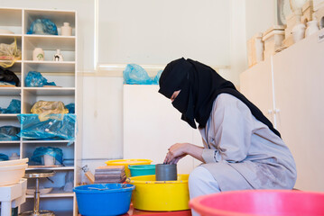 Pottery workshop, Madrasat Addeera, an artistic space where women learn crafts to be sold in the old town of AlUla, Medina Province