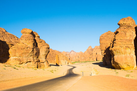 Road through the sandstone rock formations in the desert canyons of the Ashar Valley, Medina Province