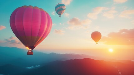 Obraz premium Hot Air Balloons over Mountains at Sunrise