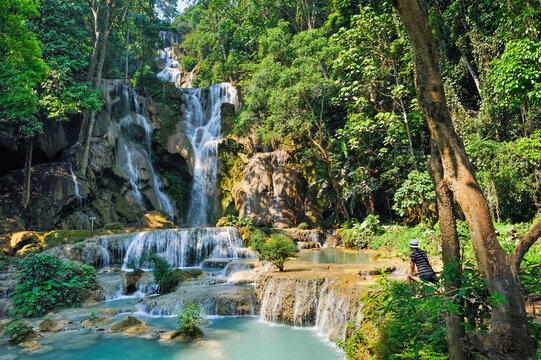 Man admiring the Kuang Si waterfalls, Luang Prabang, Laos