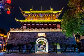 Baoning Gate, reconstructed 2004, at night, housing the drum tower in Guzicheng, ancient city of Jinhua City, Zhejiang Province