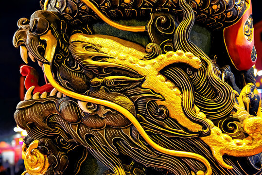 Exquisite carvings of dragons on the pillars at the temple of the Goddess of the Pearl, a local deity, in Puning City, Guangdong Province