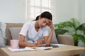 Home Office Challenges and Work-Life Balance. A woman experiences stress while trying to manage her...