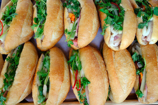Banh Mi sandwich, close-up of traditional Vietnamese baguette filled with pate, meat and vegetables, Ho Chi Minh City