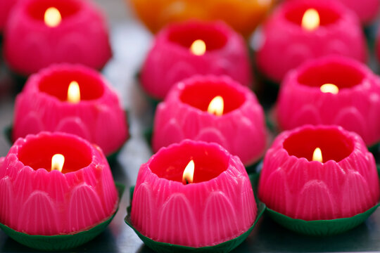 Pink lotus flower candles symbolising human growth and development, at the Thean Hou Temple, Kuala Lumpur, Malaysia