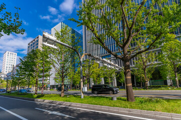 View of shops and traffic on busy shopping street, Osaka, Honshu