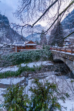 View of hotels and lodges with mountains in background during winter, Courmayeur, Aosta Valley