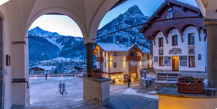 View of Piazza Abbe Henry from Church of Saint Pantalon at dusk, Courmayeur, Aosta Valley, Italian Alps