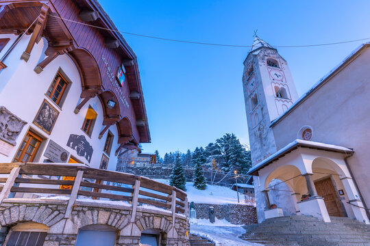 View of Church of Saint Pantalon in Piazza Abbe Henry at dusk, Courmayeur, Aosta Valley, Italian Alps