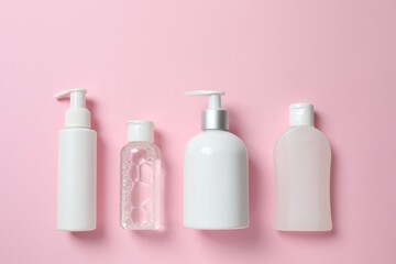Natural cosmetic products on a pink background, top view