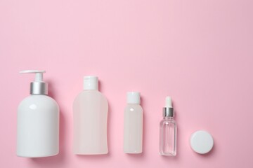 Natural cosmetic products on a pink background, top view