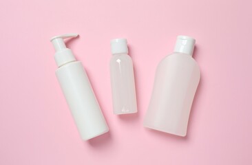 Natural cosmetic products on a pink background, top view