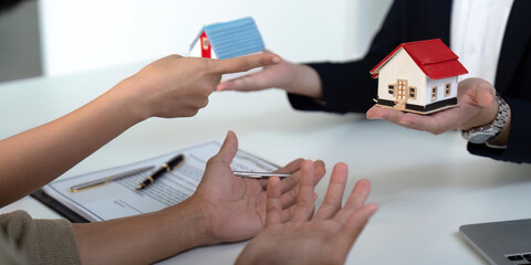 Negotiation and Decision-Making in Real Estate. A couple facilitates a discussion with their agent...