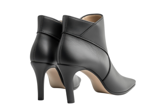 Elegant black leather ankle boots with a sleek pointed toe and a subtly curved heel, perfect for a sophisticated evening out or a stylish daytime look.