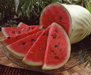 Sliced fresh water melon on natural background.