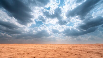 Towering cumulonimbus clouds dominate the sky over an expansive desert, casting dramatic shadows across the sunlit sandy dunes, highlighting nature's magnificence