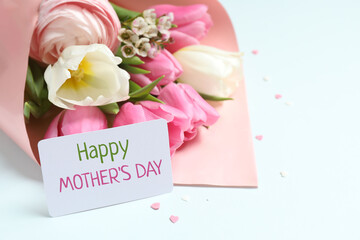 Happy Mother's day. Beautiful bouquet of fresh tulips on a colored background